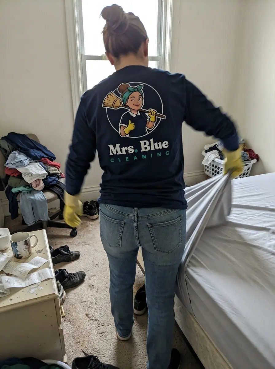 A Mrs. Blue cleaner at work in a bedroom